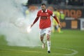 Player remove flares from the football pitch Royalty Free Stock Photo