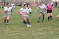 Player Running with the Ball in Rugby Match