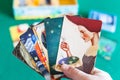 Player shows picture cards in Imaginarium game Royalty Free Stock Photo