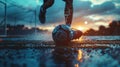 Player skillfully controlling soccer ball at sunset with water splashes in slow motion captured in close-up