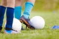 Player in soccer cleats kick soccer ball on practice drill Royalty Free Stock Photo