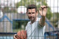 player standing outdoors with ball on hot sunny summer day