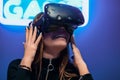 The player is surprised during the VR game. Neon sign game
