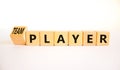 Player or teamplayer symbol. Turned wooden cubes and changed concept words Player to Teamplayer. Beautiful white table white Royalty Free Stock Photo