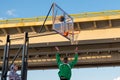 A player throws a ball into a basketball basket