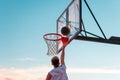 A player throws a ball into a basketball basket