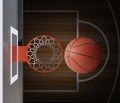 A player throws a basketball towards the net and trying to get a score, top view. 3d render Royalty Free Stock Photo