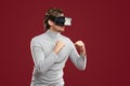 Player in VR goggles playing videogame and fighting Royalty Free Stock Photo