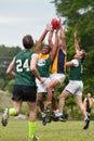 Players Battle For Ball In Australian Rules Football Game