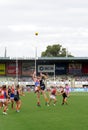 Players contesting a ball-up in the air at Ikon Park Stadium Royalty Free Stock Photo