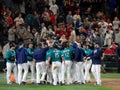 Players of home team Mariners celebrating winning game at home p