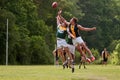 Players Jump For Ball In Australian Rules Football Game
