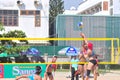 Players are playing in a match in the Women beach volleyball tournament in Nha Trang city