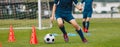 Players Practice Soccer Dribbling Skills on Training Venue. Football Drills on School Soccer Training Royalty Free Stock Photo