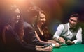 Players sitting at the playing table in the casino Royalty Free Stock Photo