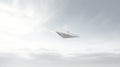 A playful and adventurous image of a white paper airplane flying in the sky. The paper airplane is flying towards the Royalty Free Stock Photo