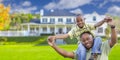 Playful African American Father and Son In Front of Home Royalty Free Stock Photo