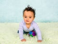 Playful baby crawling