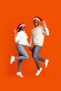 Playful Black Couple In Santa Hats Holding Hands And Showing Peace Gesture Royalty Free Stock Photo