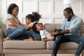 Playful black parents have fun playing with kids at home Royalty Free Stock Photo