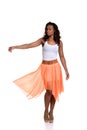 Playful black woman with orange skirt Royalty Free Stock Photo