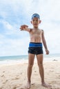 Playful boy and Hermit crab on the beach. Royalty Free Stock Photo