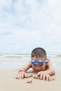 Playful boy and Hermit crab on the beach. Royalty Free Stock Photo