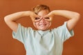 Playful Boy Making Faces in Studio Royalty Free Stock Photo