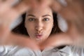 Playful brunette lady having fun, sending air kisses. Royalty Free Stock Photo