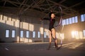 Rhythmic gymnast with ribbon in bark gym