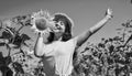 Playful child girl harvesting sunflowers at farm Royalty Free Stock Photo