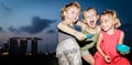 Playful children playing and posing funnily at Marina Barrage, Singapore