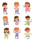 Playful Children in Stained Clothes Holding Paintbrushes and Paints Vector Illustrations Set Royalty Free Stock Photo