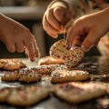 Playful close-up of childrens hands dipping colorful sprinkles onto heart-shaped cookies