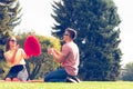 Playful couple in park. Royalty Free Stock Photo