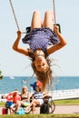 Playful crazy girl on swing.