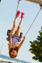 Playful crazy girl on swing.