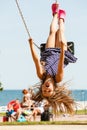 Playful crazy girl on swing.