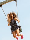 Playful crazy girl on swing.