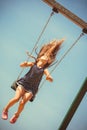 Playful crazy girl on swing.