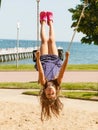 Playful crazy girl on swing.