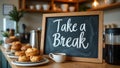 Playful cursive Take a Break on caf chalkboard pastries coffee on counter Royalty Free Stock Photo