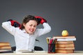 Playful cute little girl having fun in boxing gloves while leaning on grey background, selective focus Royalty Free Stock Photo