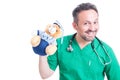 Playful doctor or pediatrician holding teddy bear Royalty Free Stock Photo