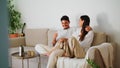 Playful family flirting couch closeup. Handsome man cuddling woman relaxing sofa Royalty Free Stock Photo