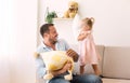 Playful family having a pillow fight together Royalty Free Stock Photo