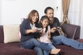 Playful family playing video games