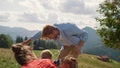 Playful father playing son on green mountain. Happy family having fun on picnic. Royalty Free Stock Photo