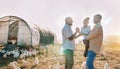 Playful, gay couple and chicken with black family on farm for agriculture, environment and bonding. Relax, nature and Royalty Free Stock Photo