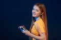 Playful girl holding video game joystick